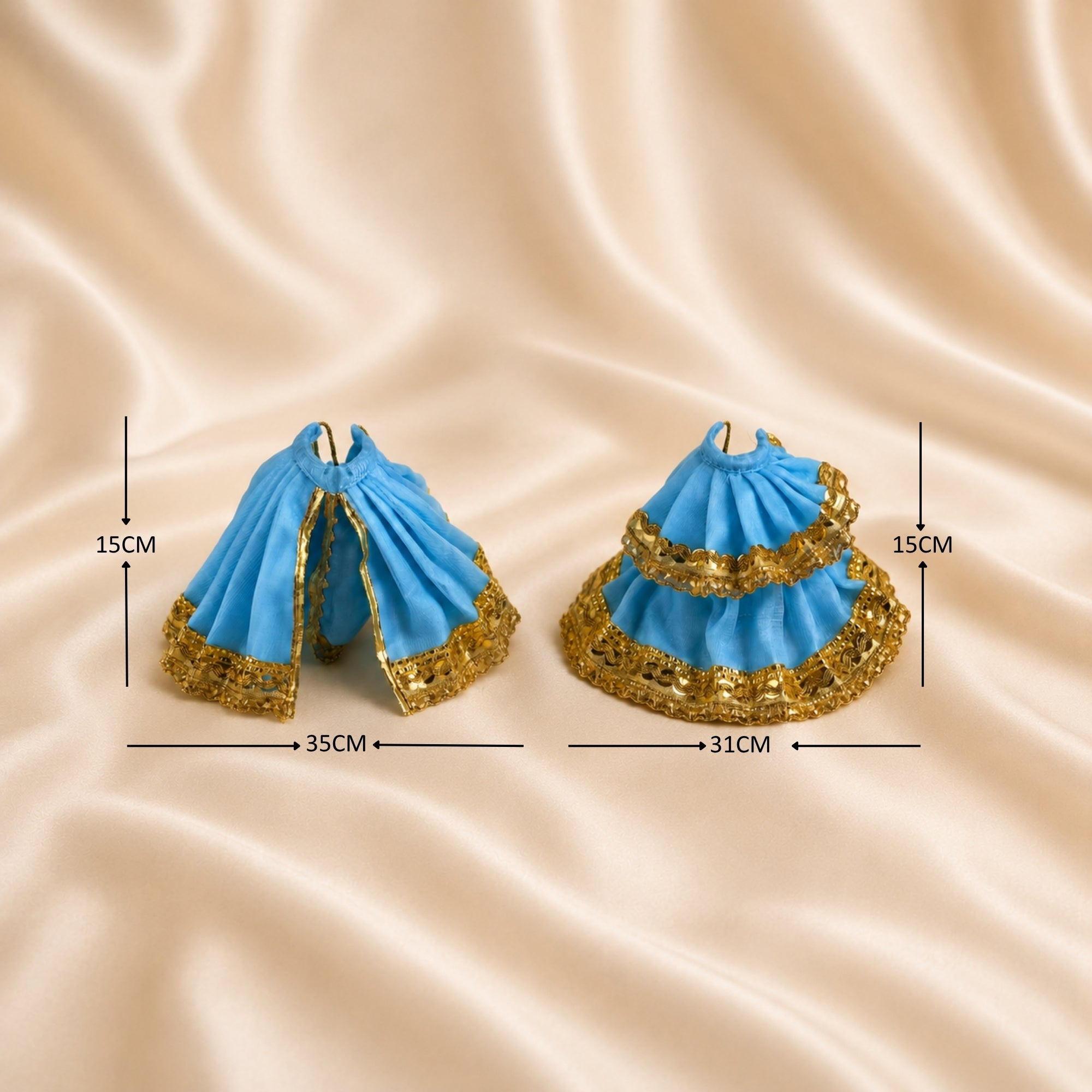 Radha Krishna blue and gold poshak set laid flat with golden lace borders