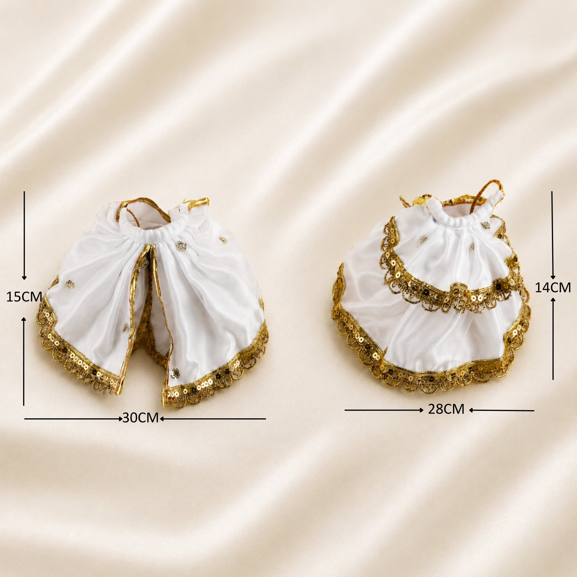 Radha Krishna white and gold poshak set laid flat with golden lace borders