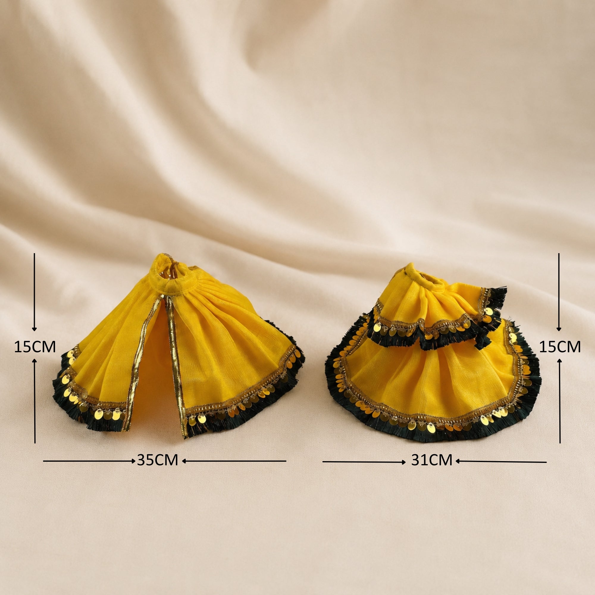 Radha Krishna yellow and gold poshak set laid flat with golden lace borders