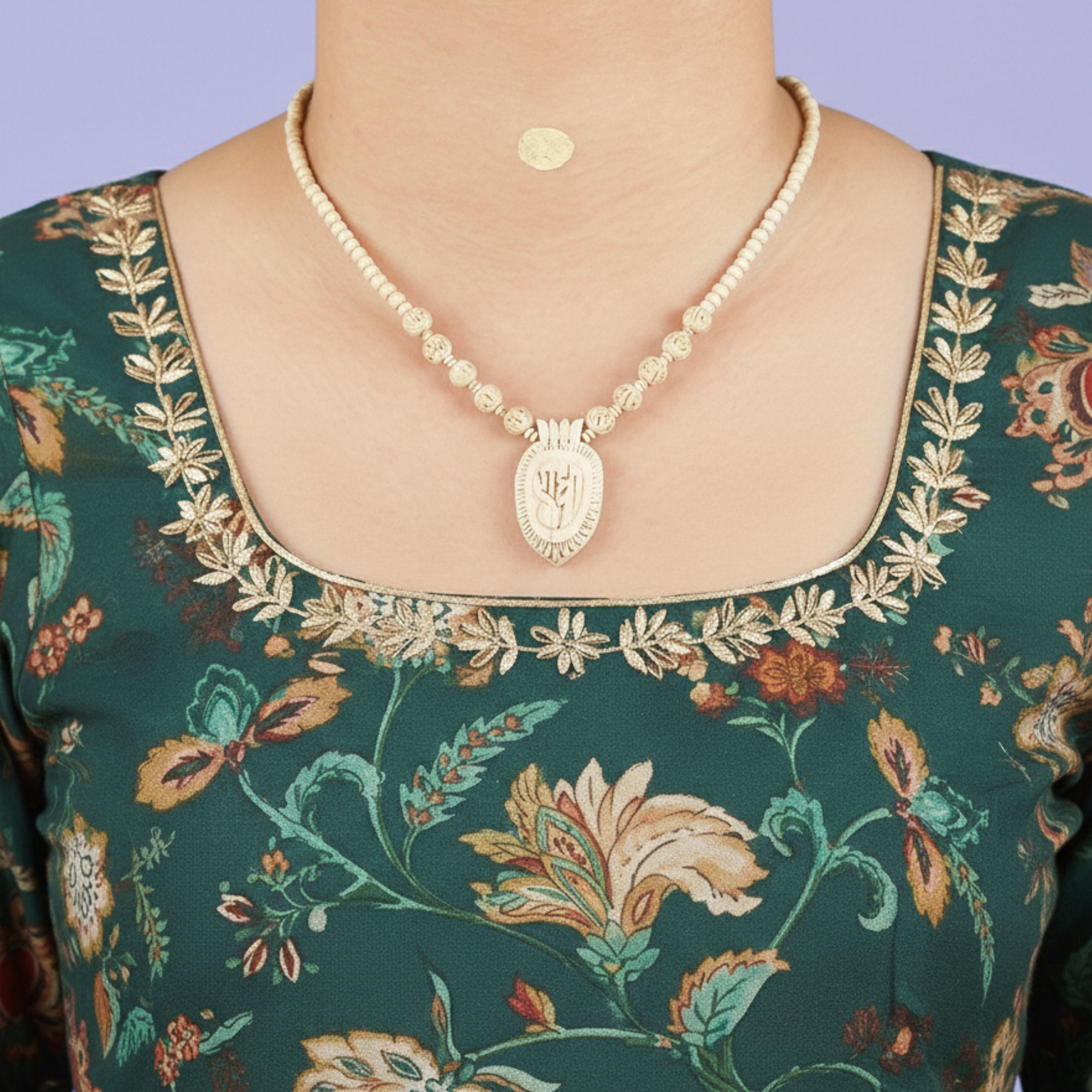 Woman wearing an original Tulsi kanthi mala with a carved wooden Radha name pendant