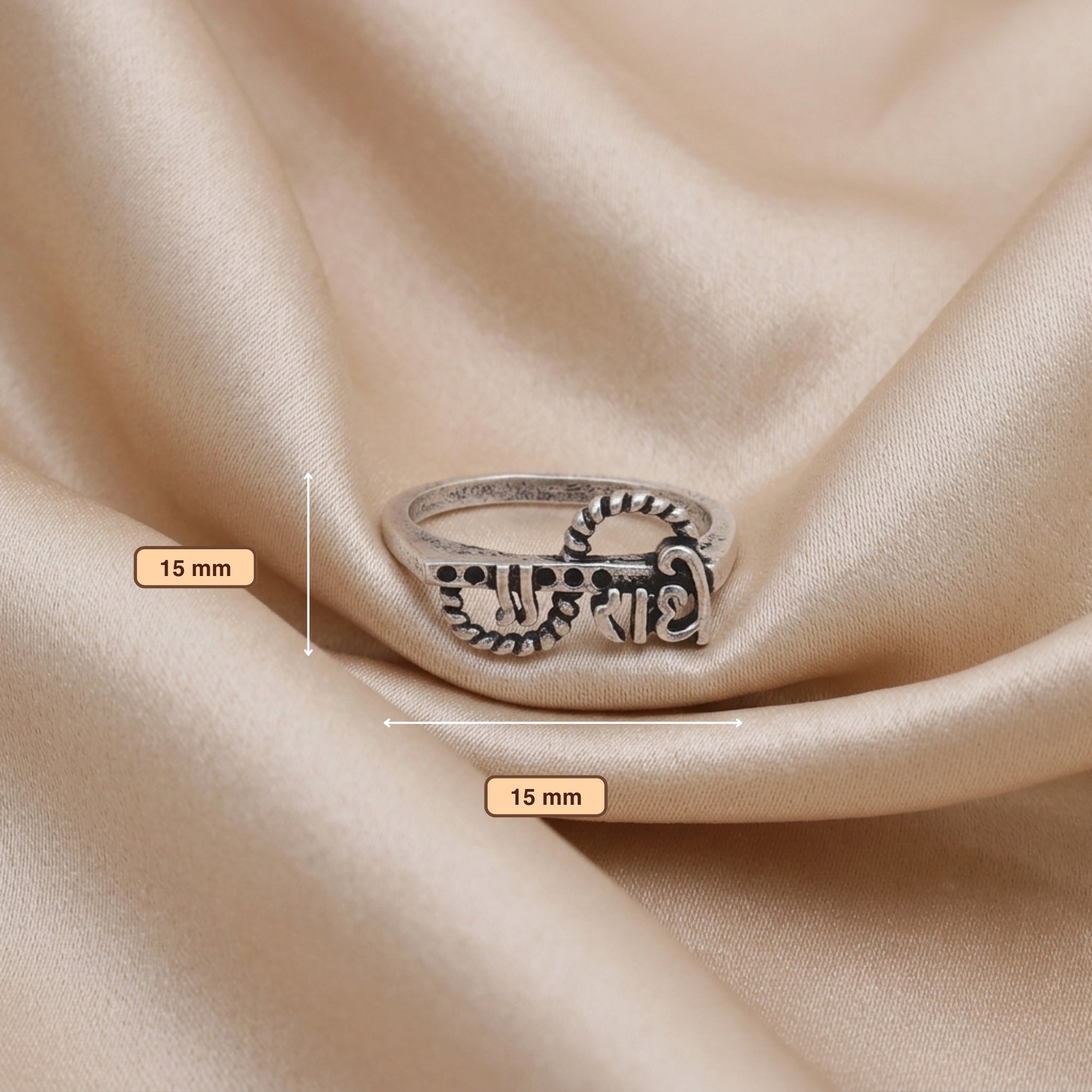 Front view of Radha name oxidized ring with flute and peacock feather design