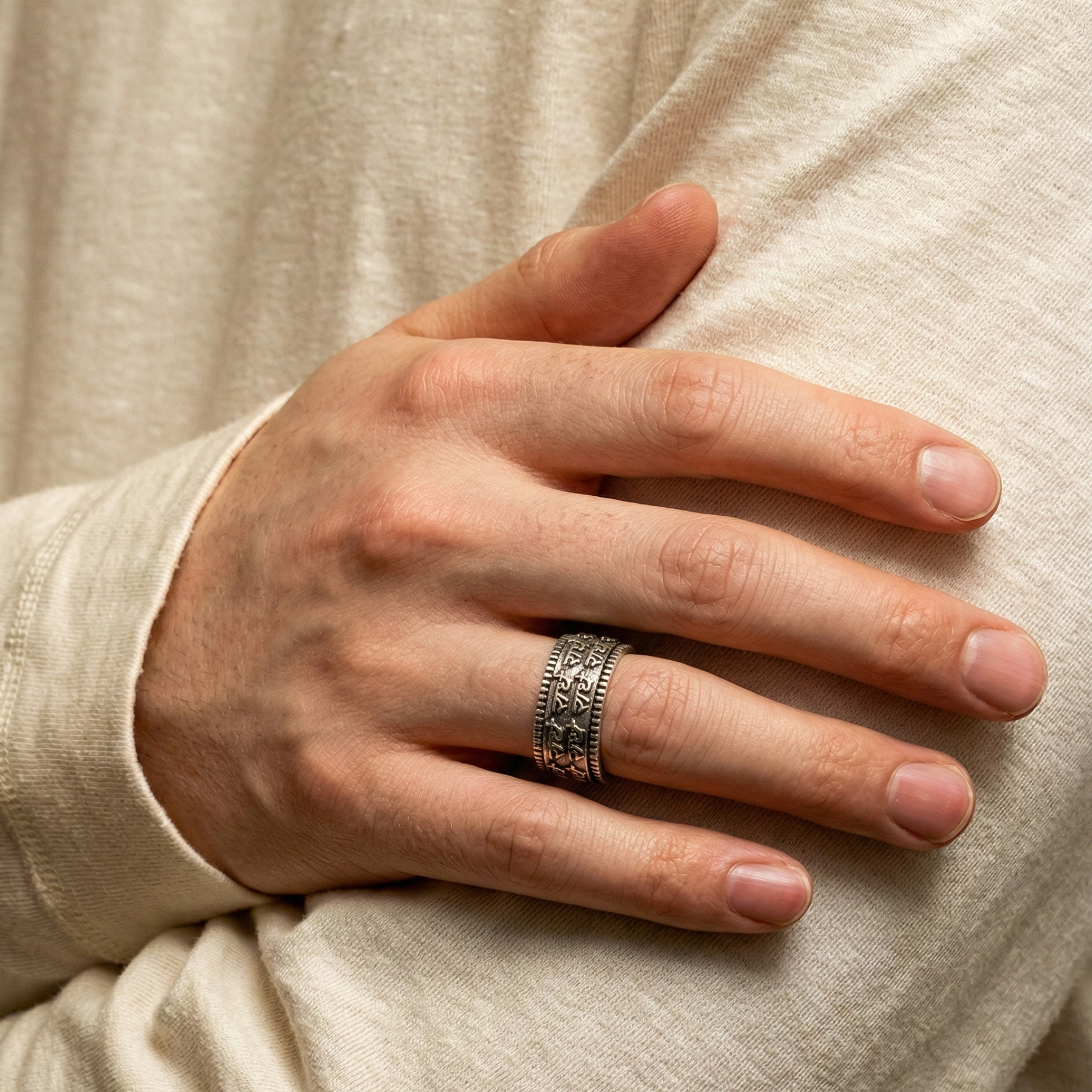 Radhe Mantra oxidized metal ring with intricate design worn on finger