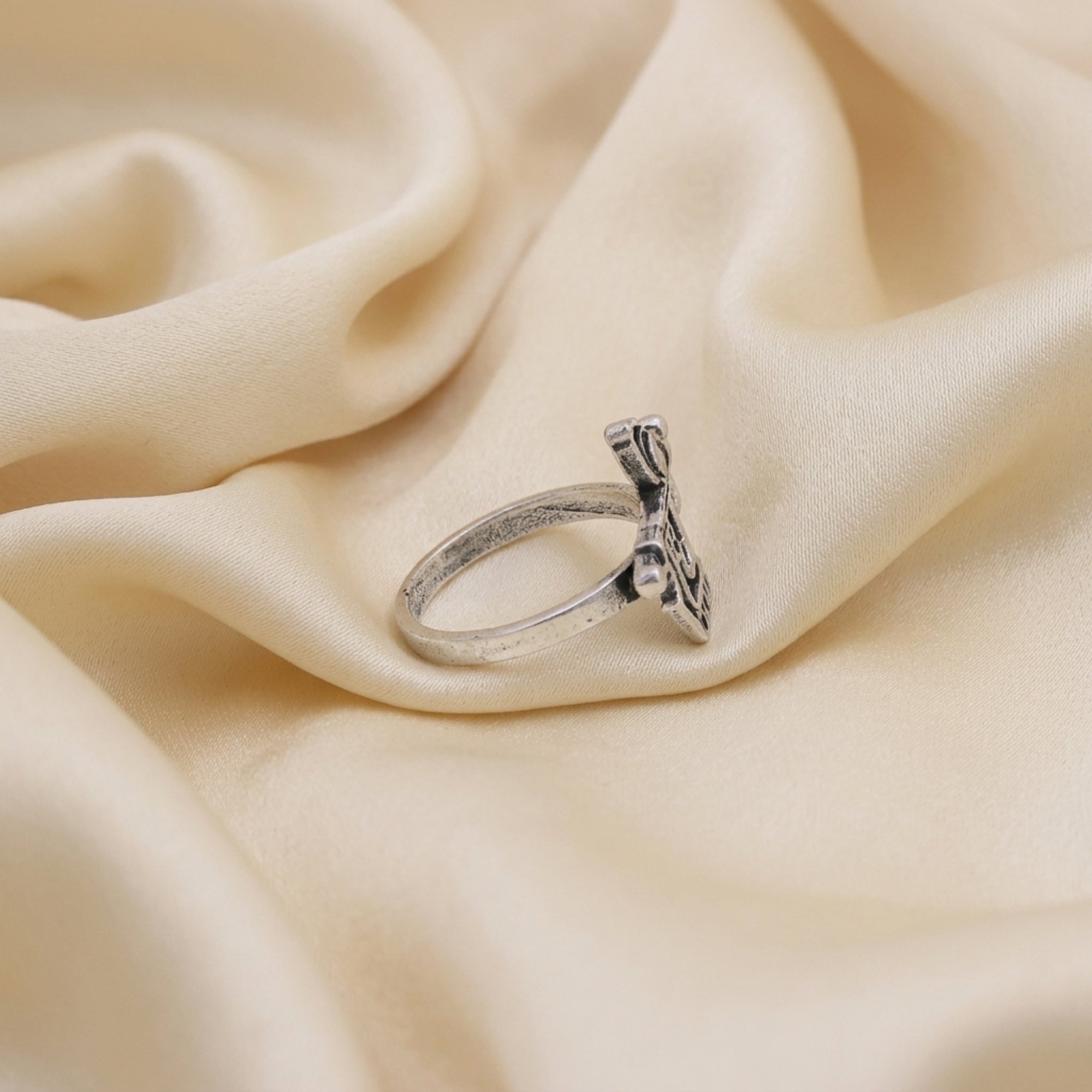 Side view of Radhe Radhe ring showing the silver-tone band and traditional Hindi script design