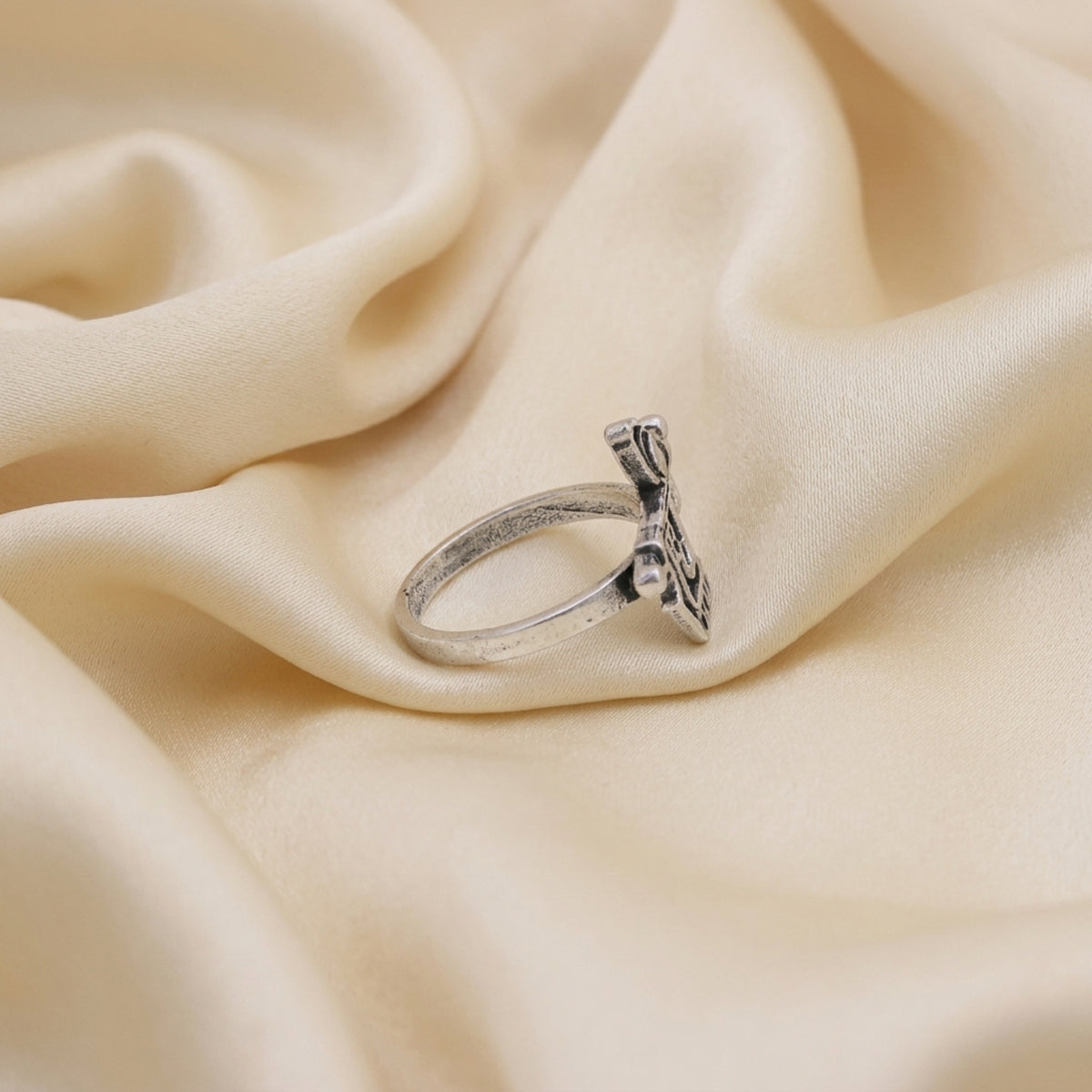 Side view of Radhe Radhe ring showing the silver-tone band and traditional Hindi script design