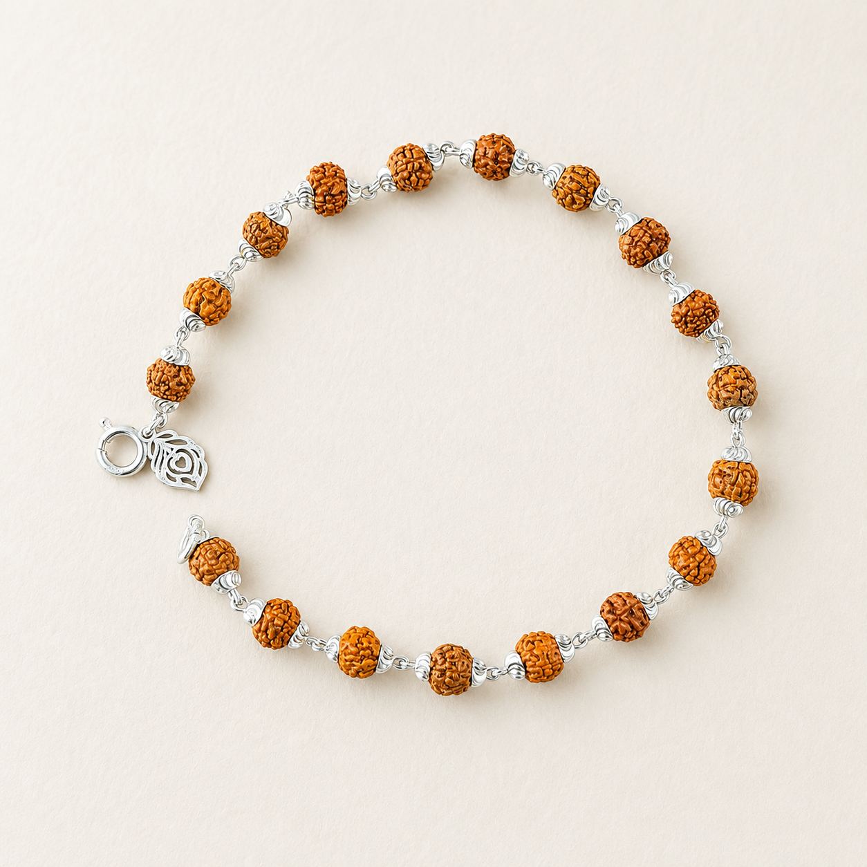 Rudraksha bracelet with silver capping displayed flat with details