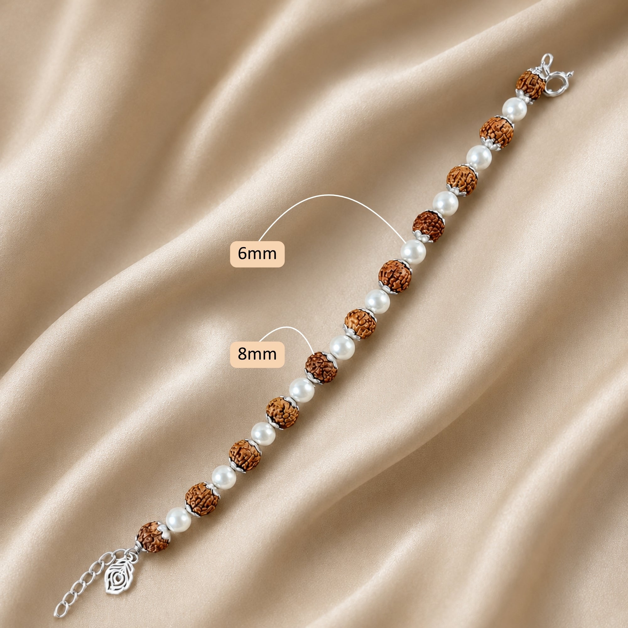 Full length display view of silver rudraksha and white pearl bracelet