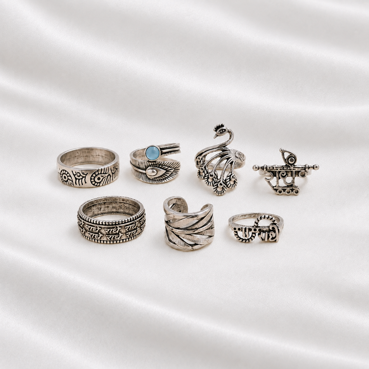Set of 7 oxidised metal imitation rings with varied traditional-inspired designs