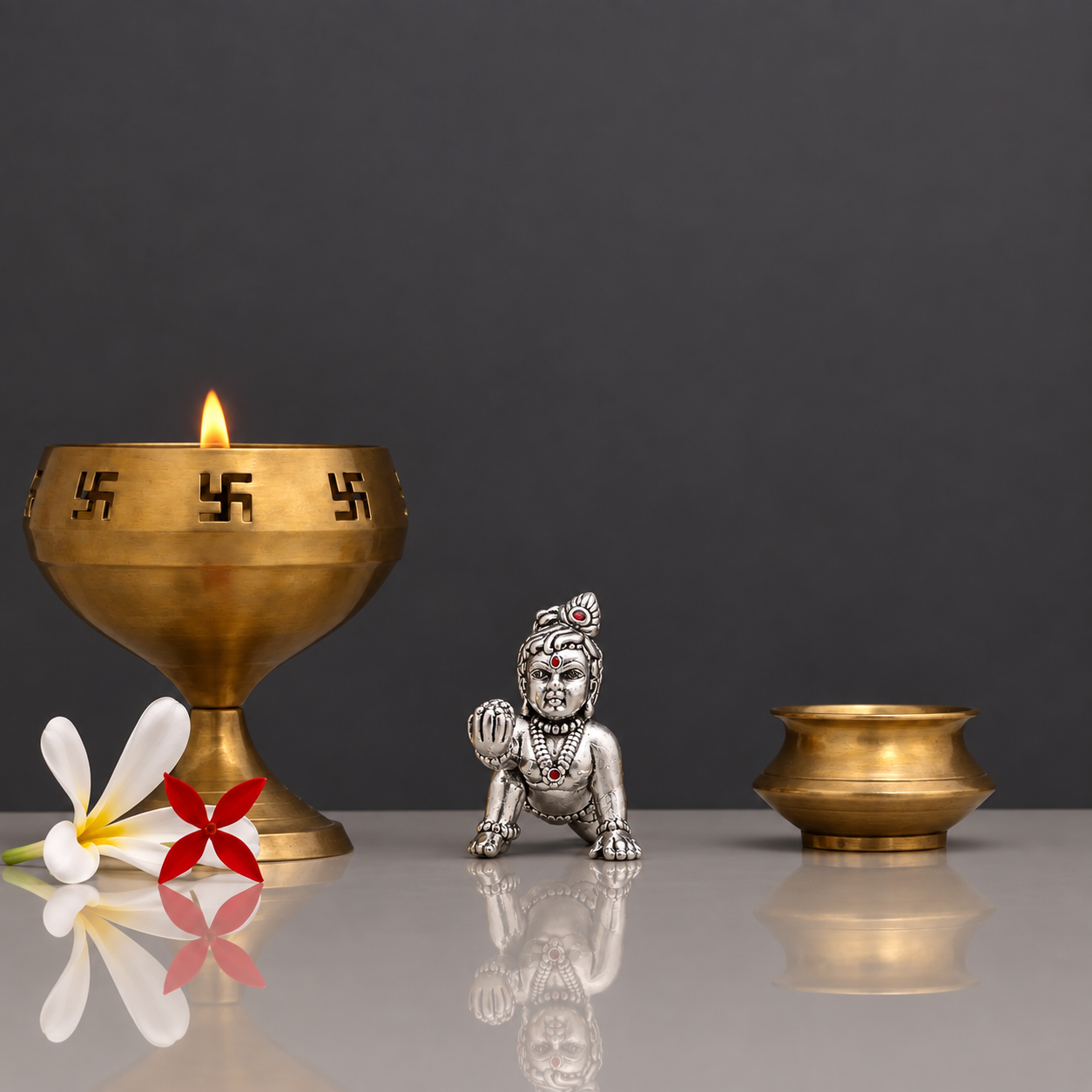 pure Silver crawling Laddu Gopal idol holding a laddu.