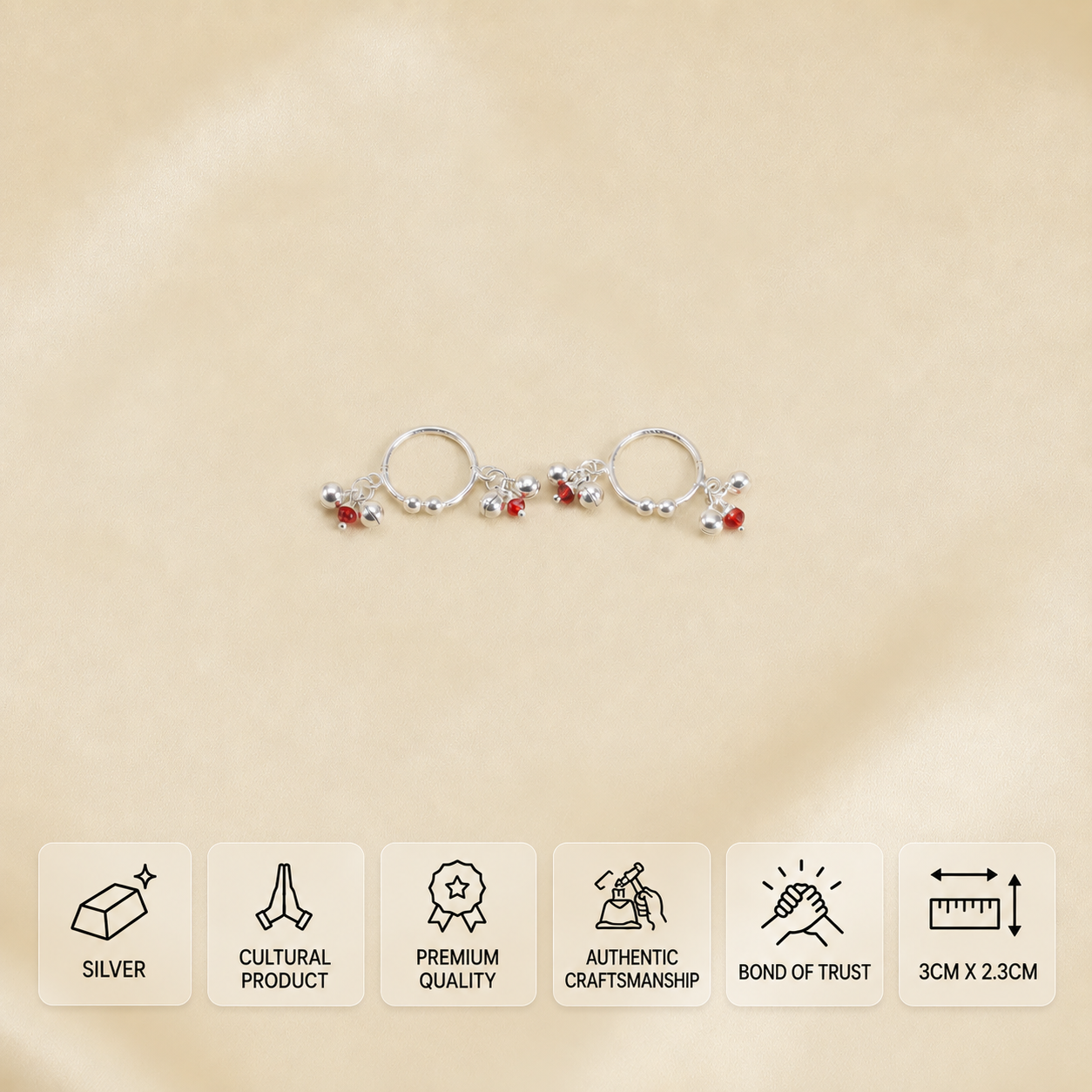 Pair of silver ghungroo idol ornaments with red beads, with 3 × 2.3 cm dimensions.