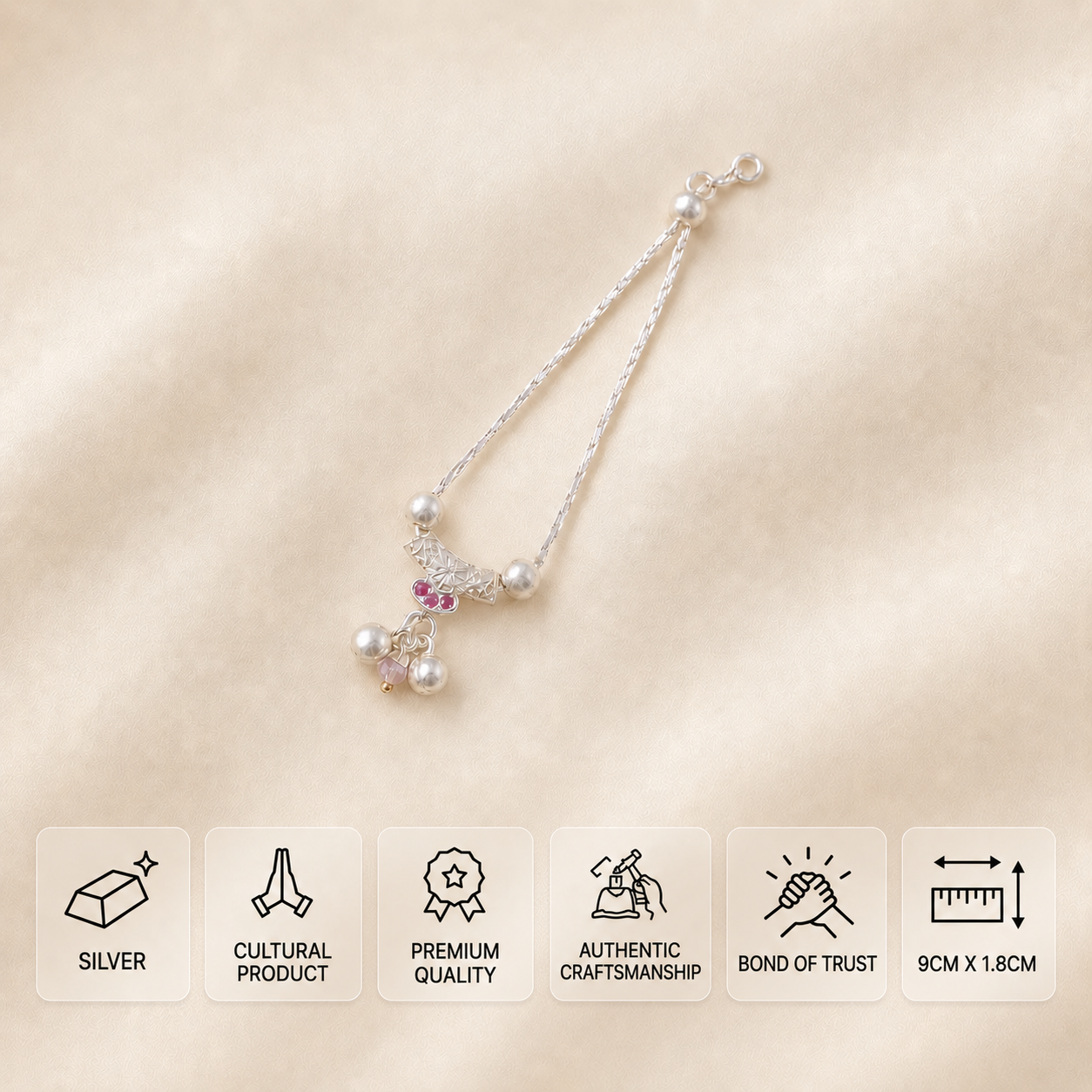 Silver idol necklace with pink stones, silver balls and a pale pink hanging bead, measuring 9 × 1.8 cm.
