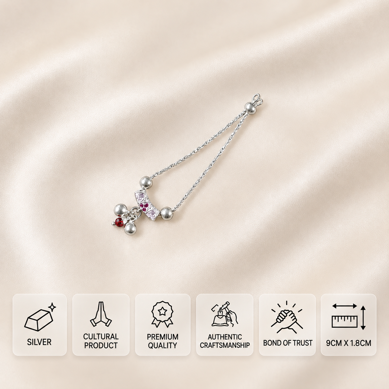 Silver idol necklace with pink stones, silver balls and a red hanging bead, measuring 9 × 1.8 cm.
