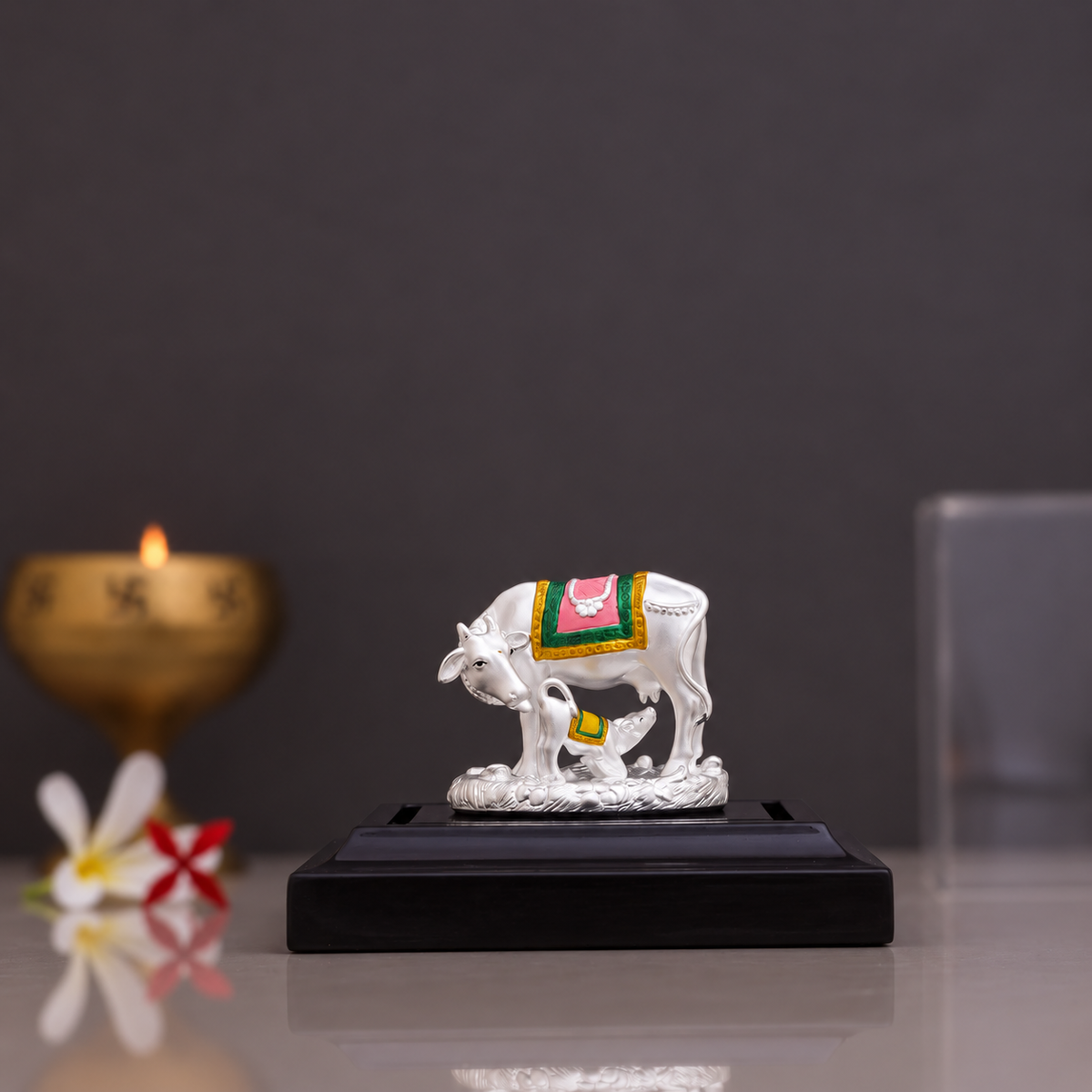 Silver Kamdhenu cow and calf idol with colourful saddle detailing