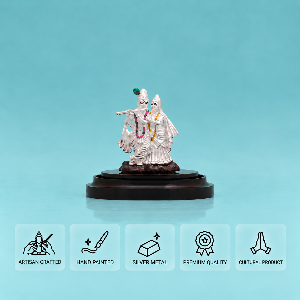 Silver Radha Krishna idol with Krishna playing the flute on a dark display stand, with five feature cards below.