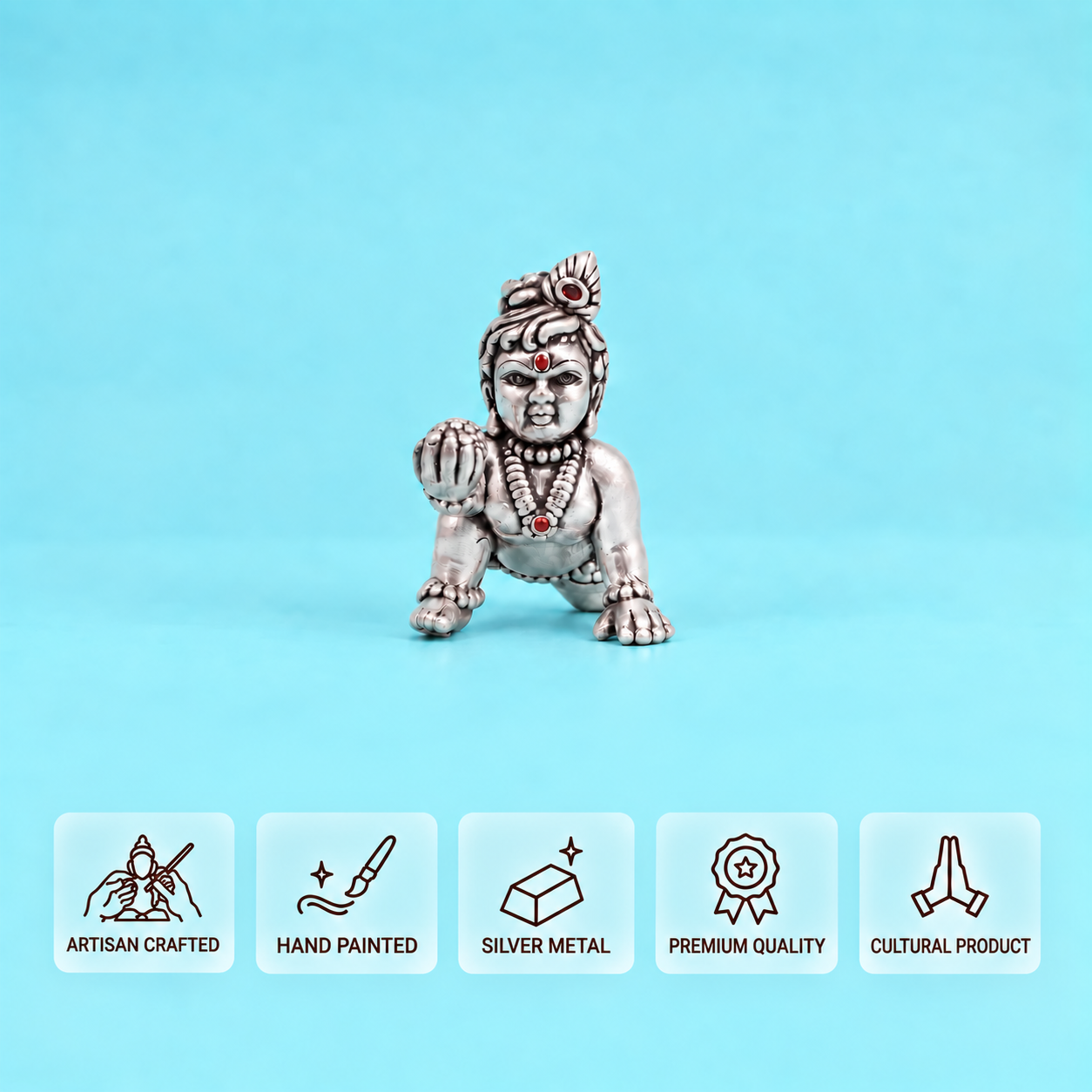 Front view of a silver crawling Laddu Gopal idol with feature cards 