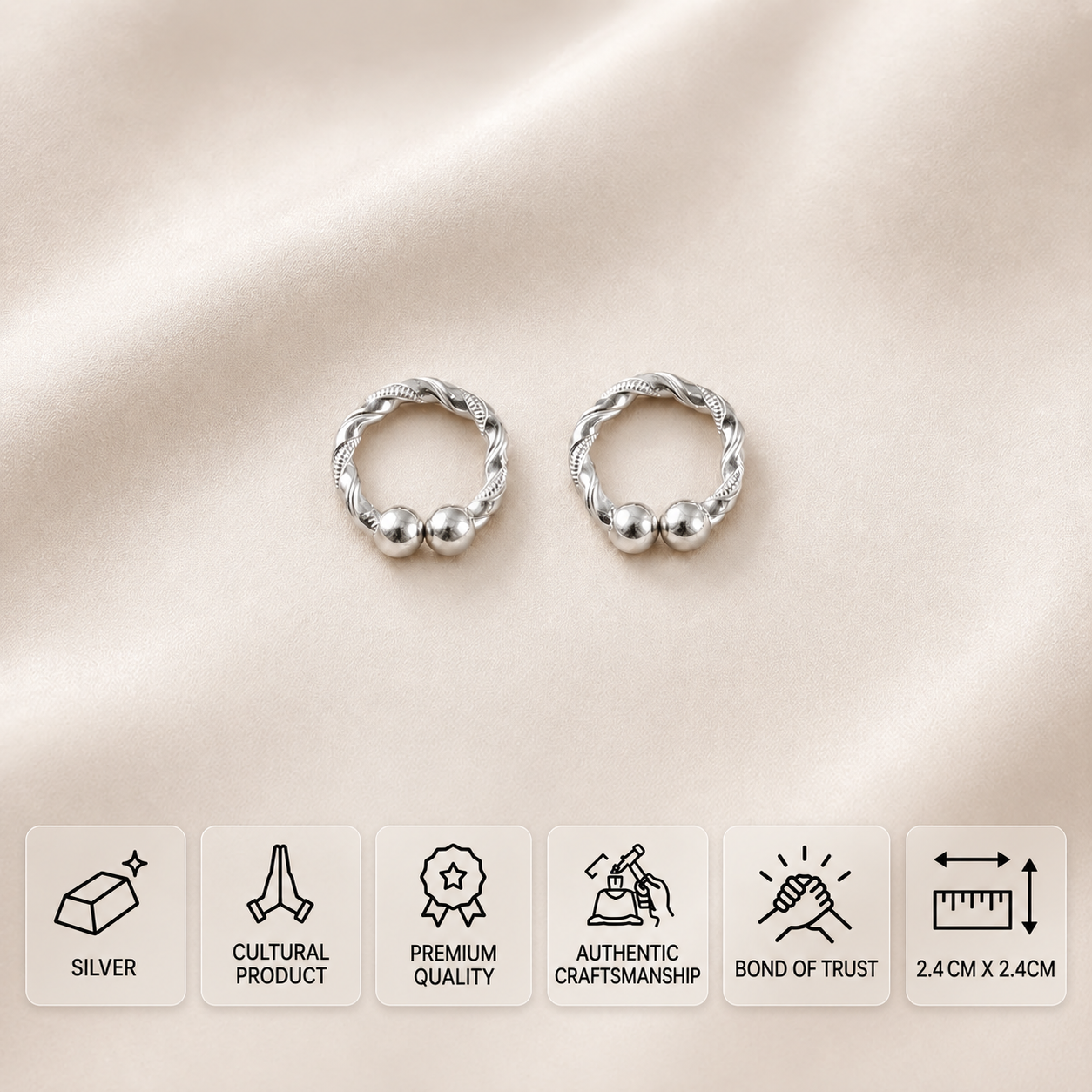 Pair of twisted silver idol bangles with round ball ends, measuring 2.4 × 2.4 cm.