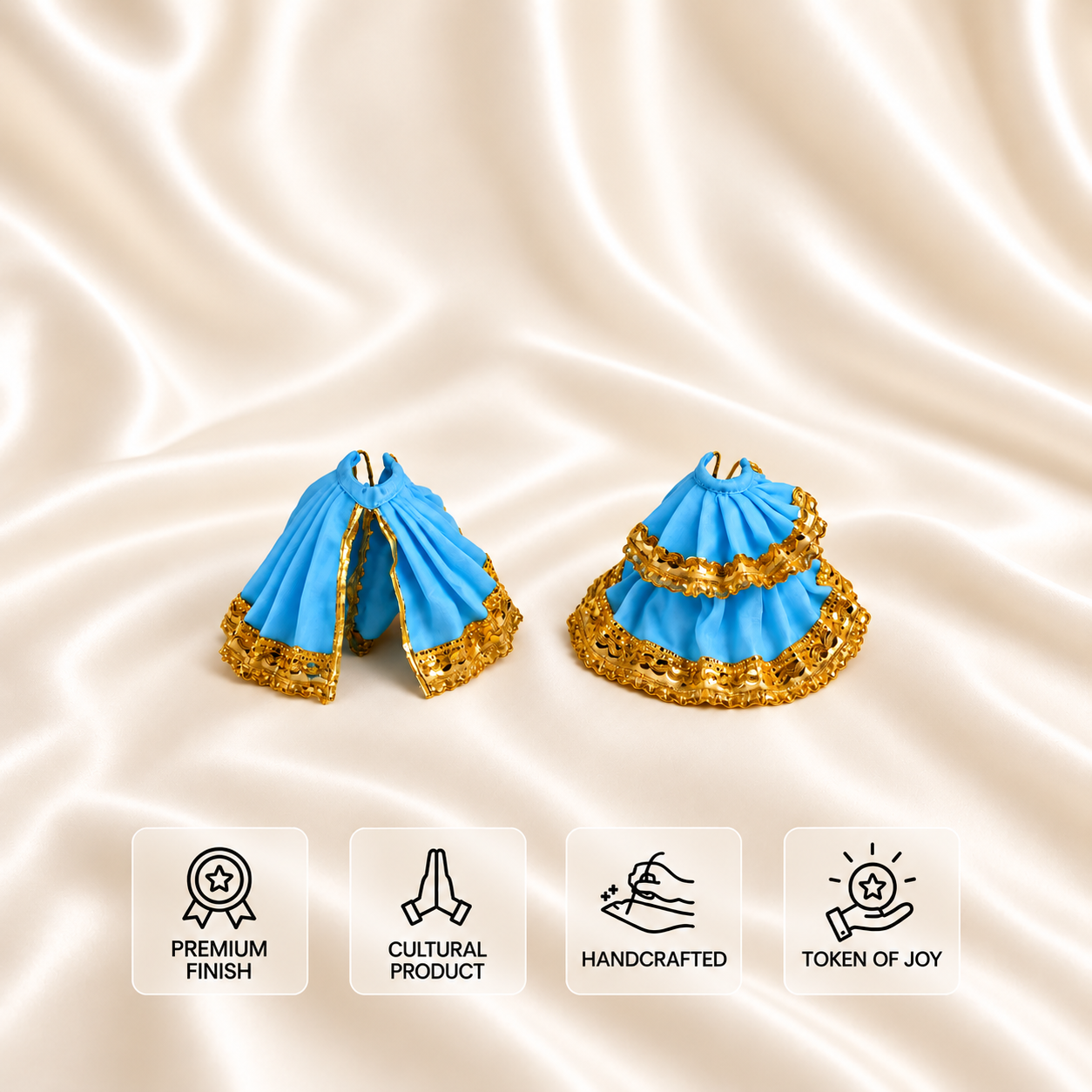 Sky blue Laddu Gopal poshak shown in two views with an ornate gold-tone lace border on a cream background.