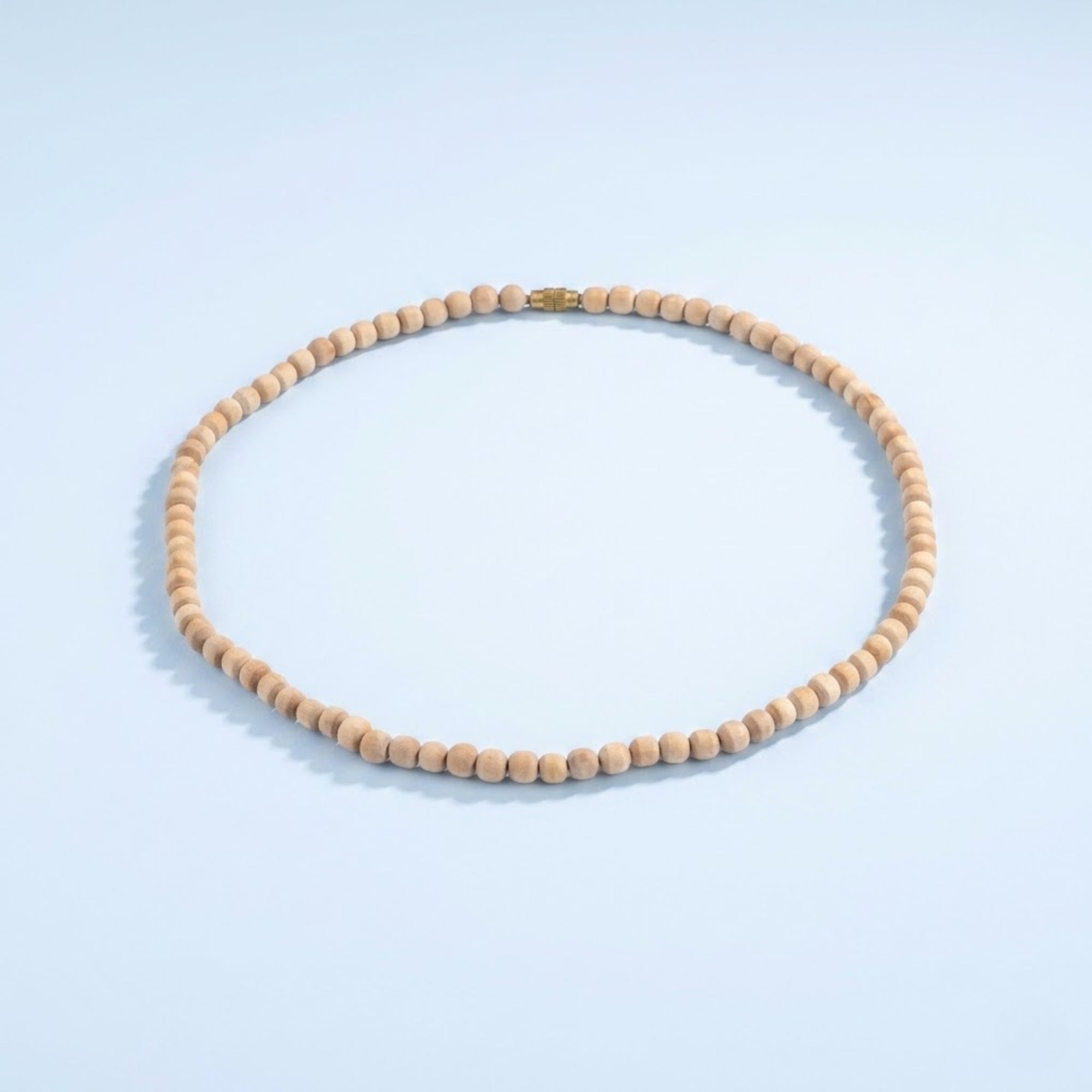 Close up of smooth round authentic Tulsi wood beads on a kanthi mala