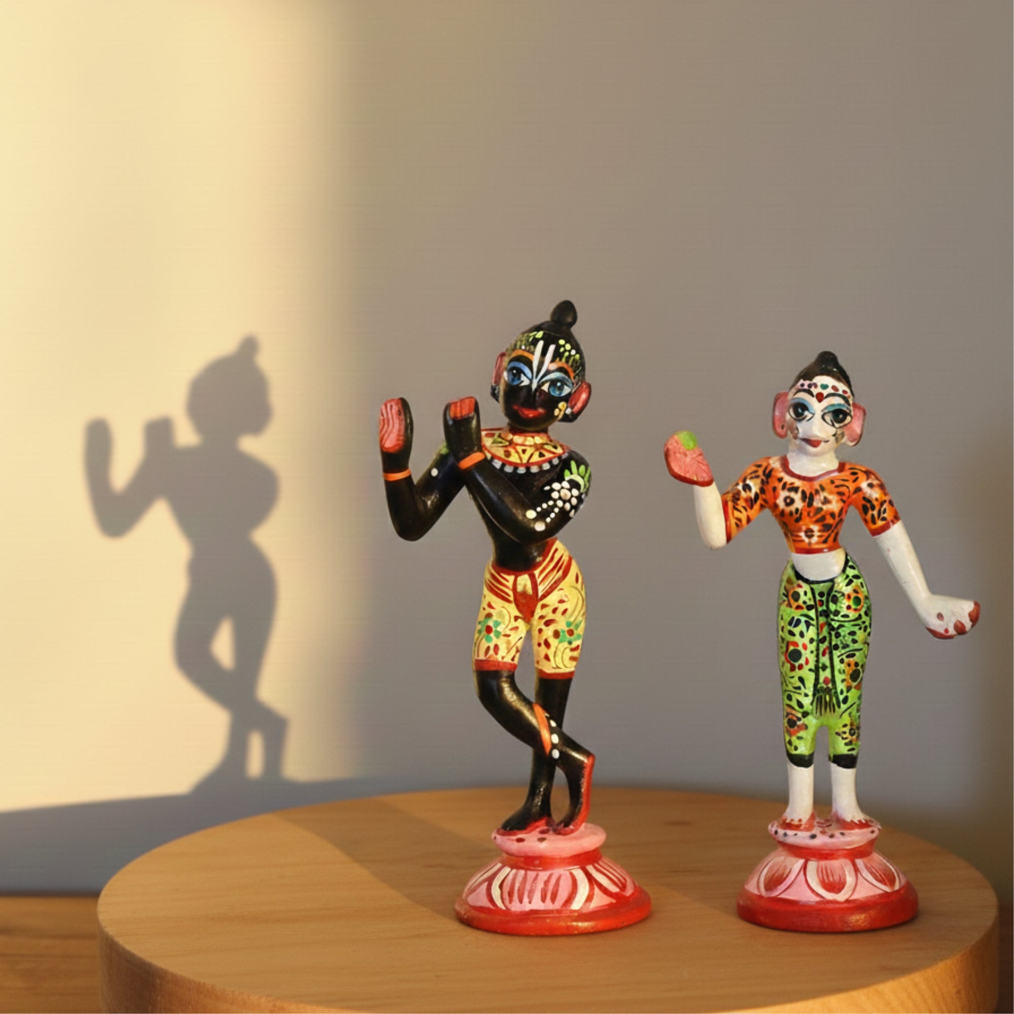 Hand-painted decorative Shringar standing Radha Krishna brass idols displayed on a wooden base