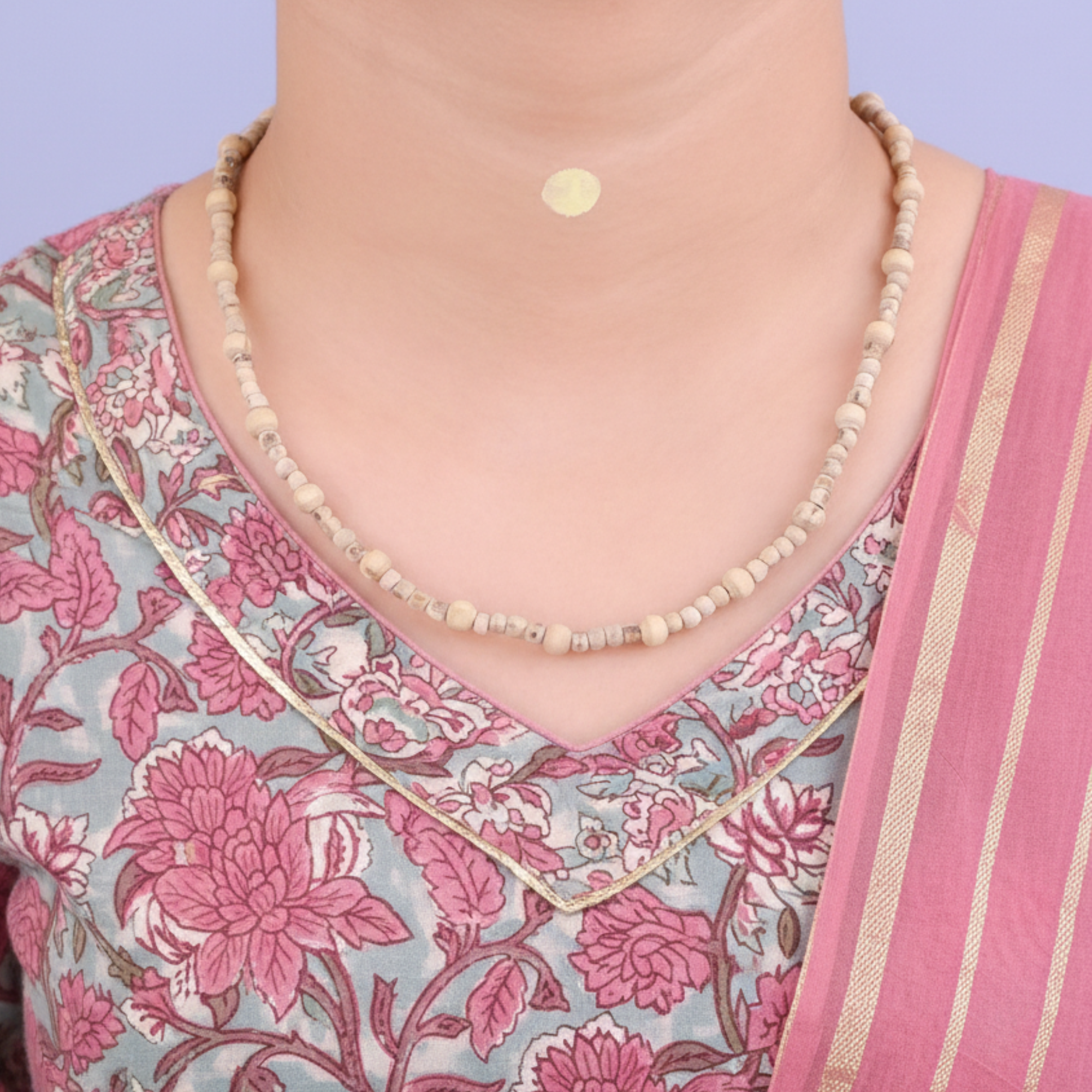 Woman wearing a traditional pure Tulsi kanthi mala sourced from Mathura