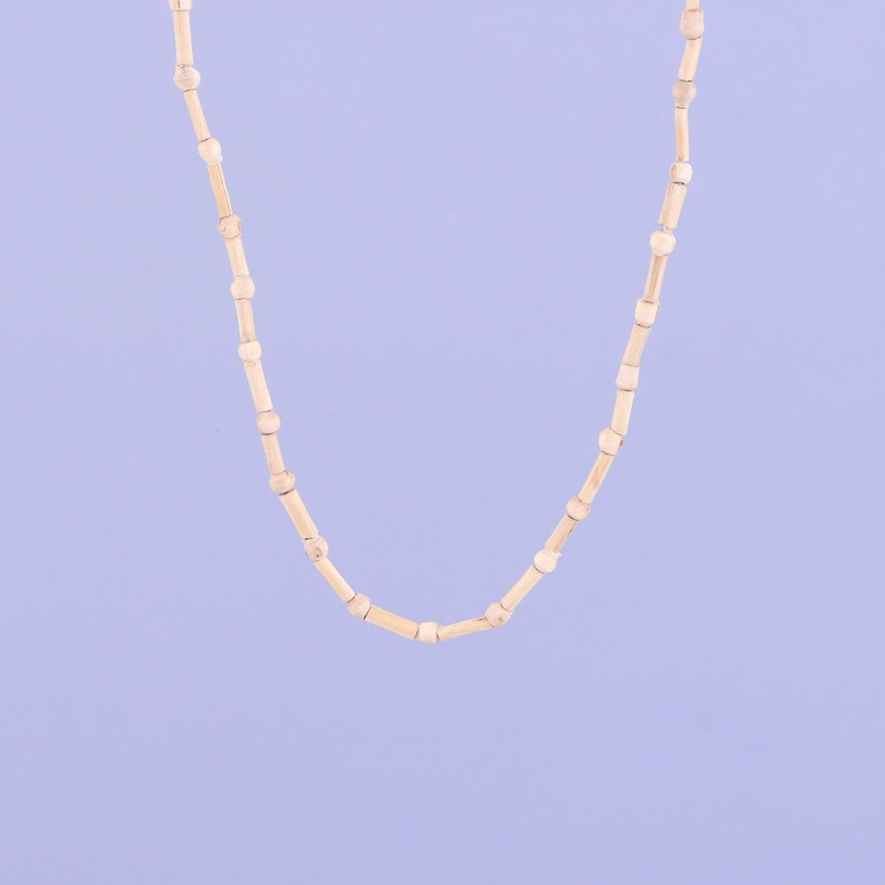 Close up of pure wooden cylindrical beads on a Tulsi kanthi neck mala