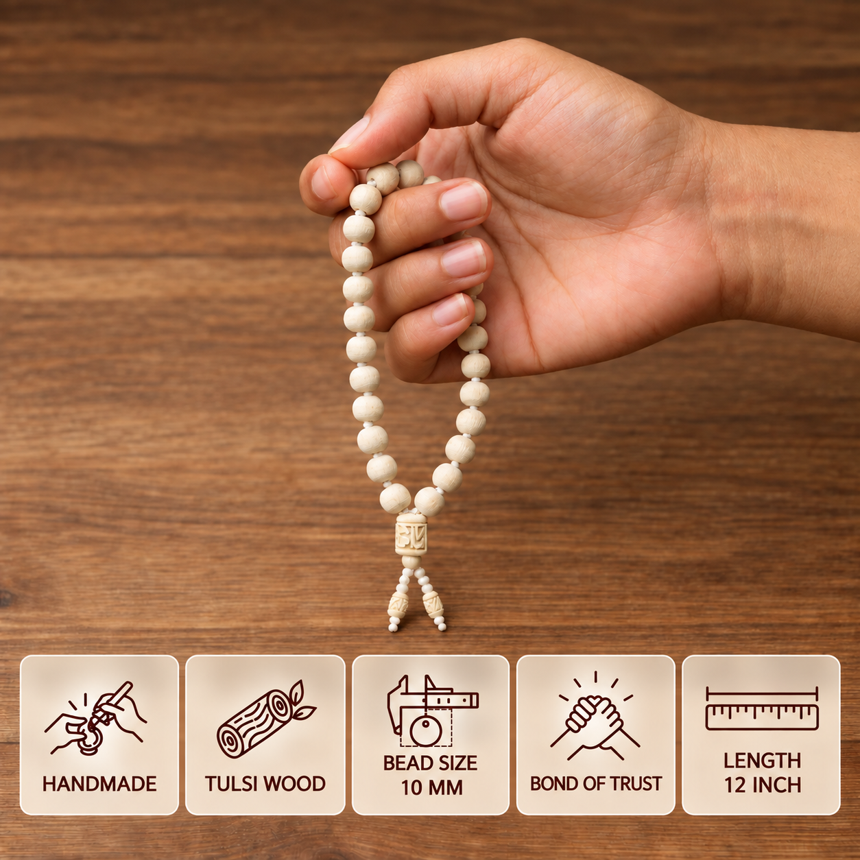 Hand holding a Tulsi bead mala with feature cards showing 10 mm bead size and 12 inch length