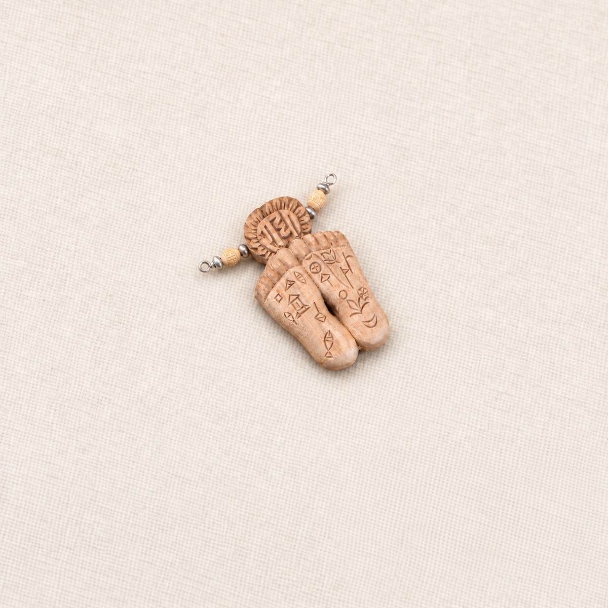 Tulsi wood Charan Paduka pendant with carved cultural symbols, Tulsi beads