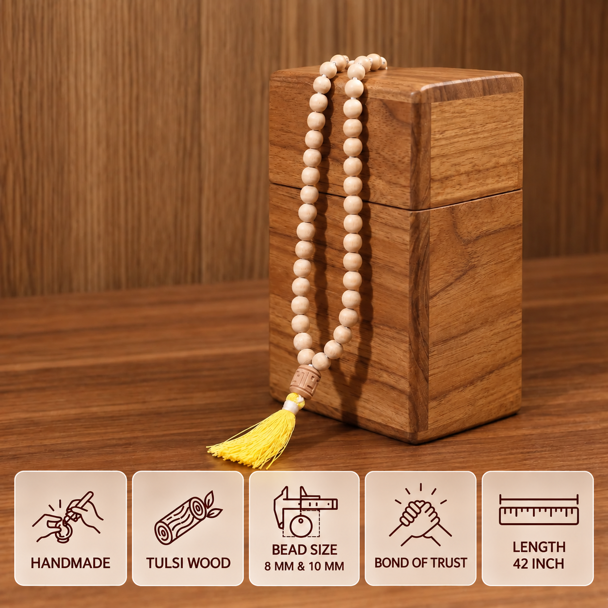 Tulsi japa mala with yellow tassel on a wooden display, with feature cards showing 8 mm and 10 mm beads and 42 inch length.
