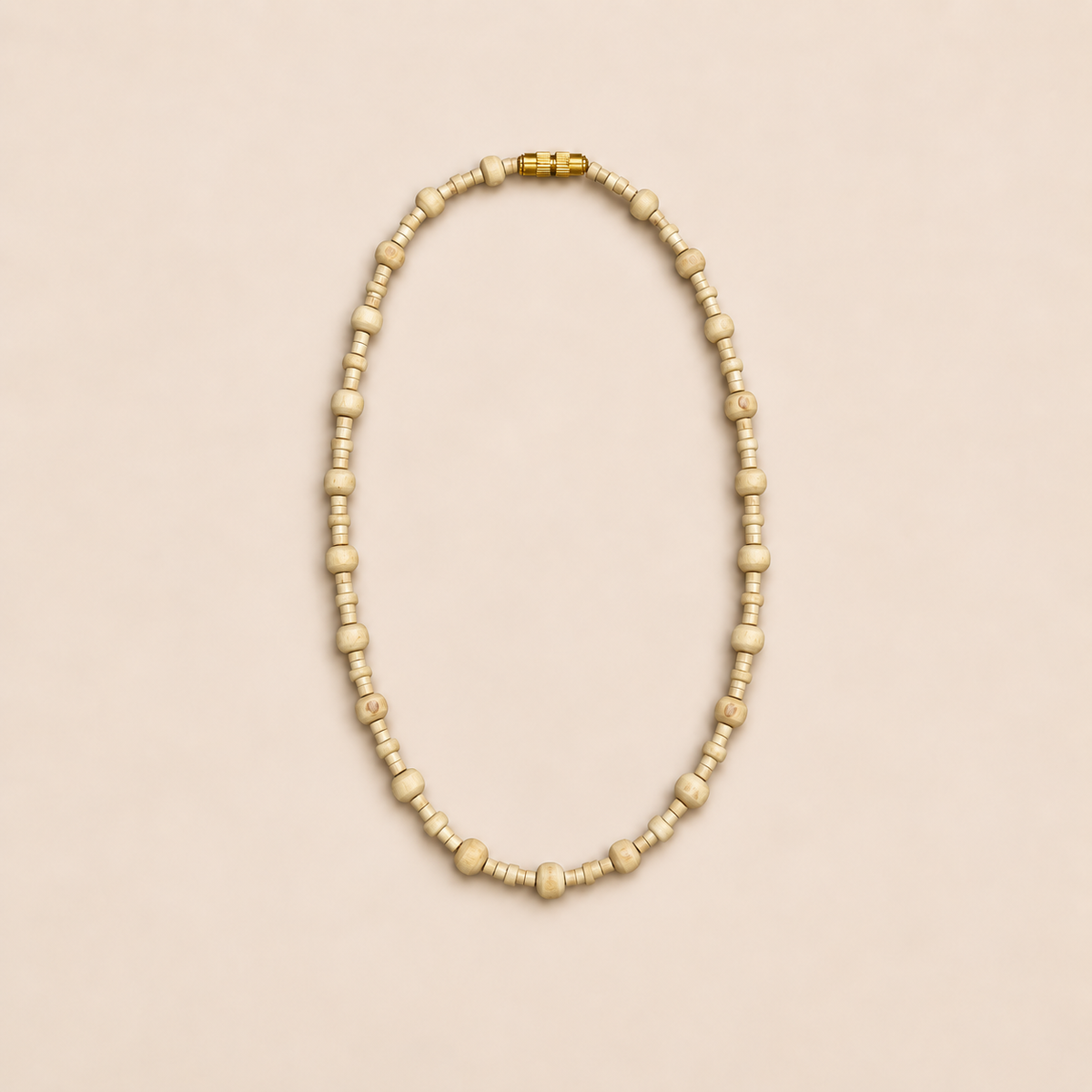 Tulsi kanthi mala with small cylindrical and larger wooden beads and a gold-tone screw clasp on a beige background.