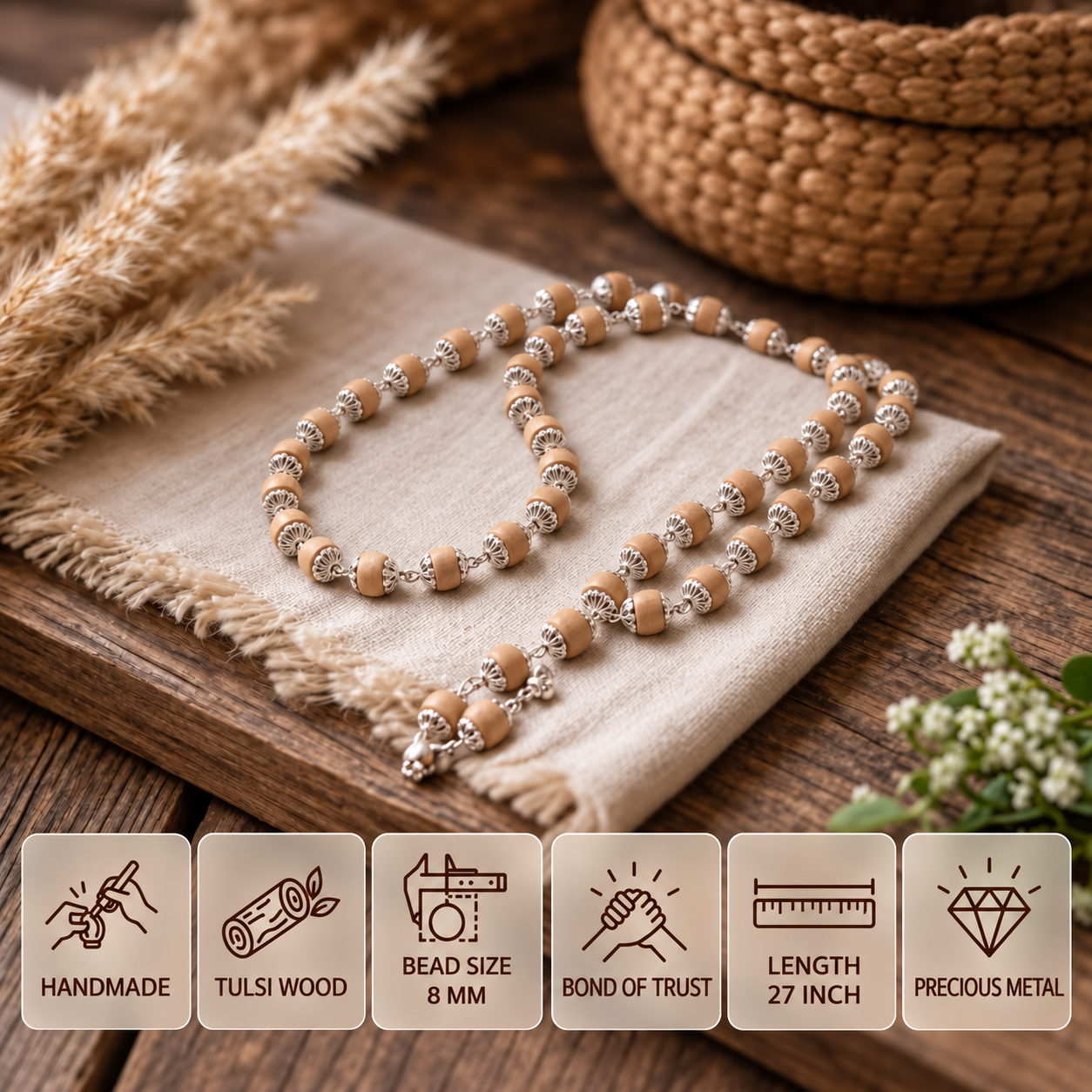 Tulsi bead mala with silver fittings displayed on woven cloth, with feature cards showing 8 mm beads and a 27 inch length.