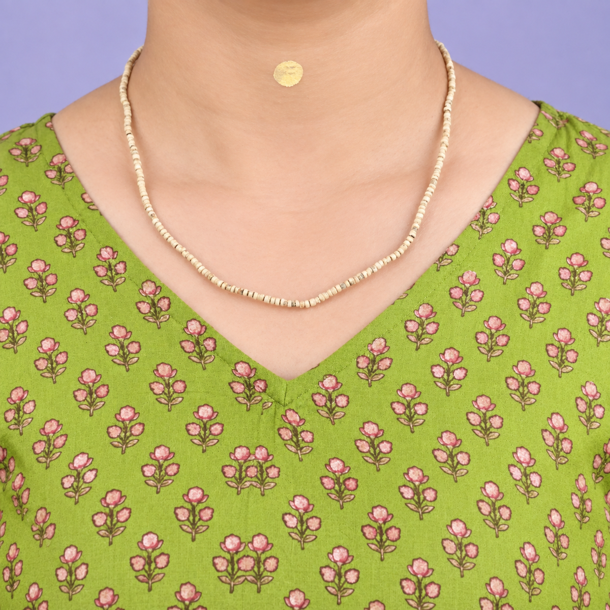 Woman wearing natural Tulsi Mala with handmade 3 mm Tulsi beads and 16 inch length