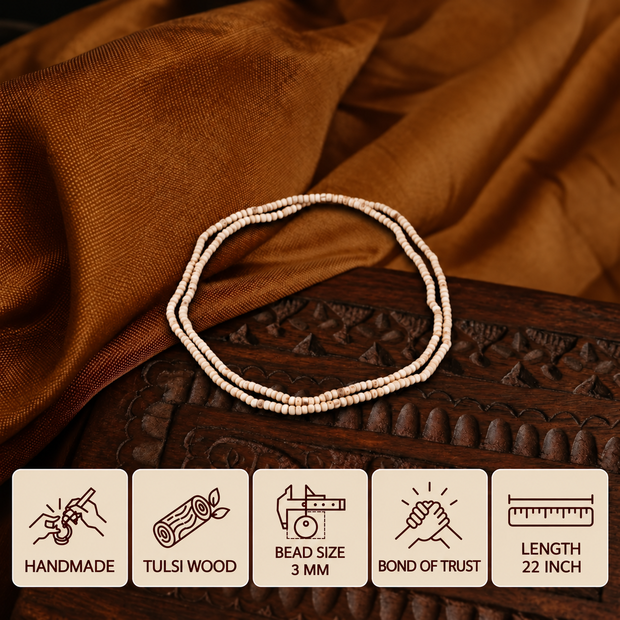 Brown fabric aur carved wooden box par rakhi Tulsi mala, 3 mm beads aur 22 inch length ke feature cards ke saath.