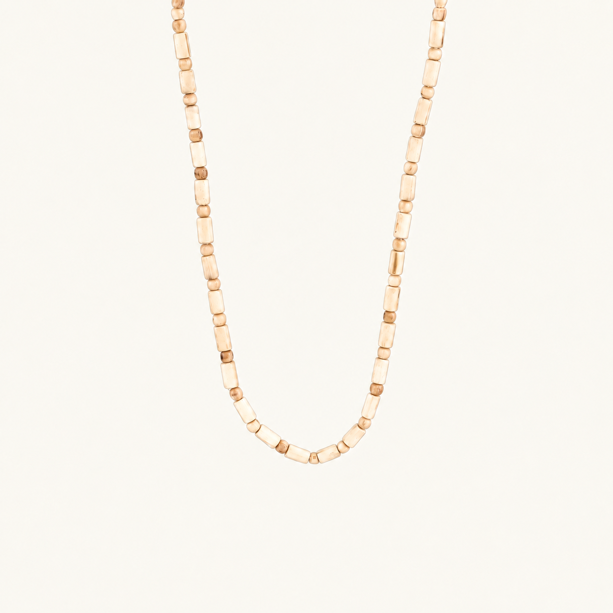 Off-white background par U shape mein latakti Tulsi wood bead mala.