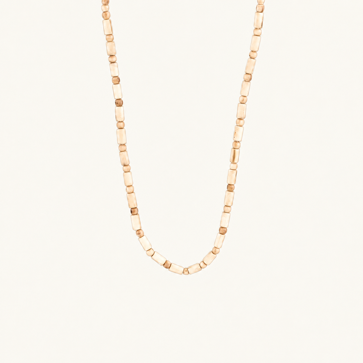 Off-white background par U shape mein latakti Tulsi wood bead mala.