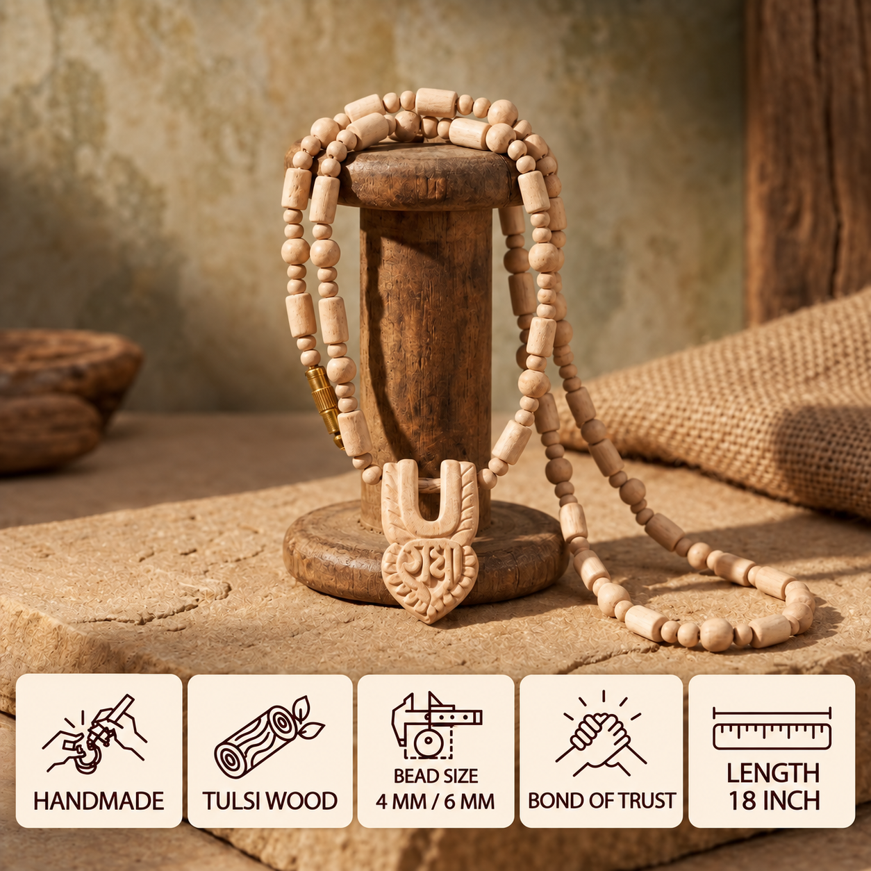 Tulsi wood bead mala with a carved pendant draped over a wooden stand, showing 4 mm and 6 mm bead sizes and an 18 inch length.