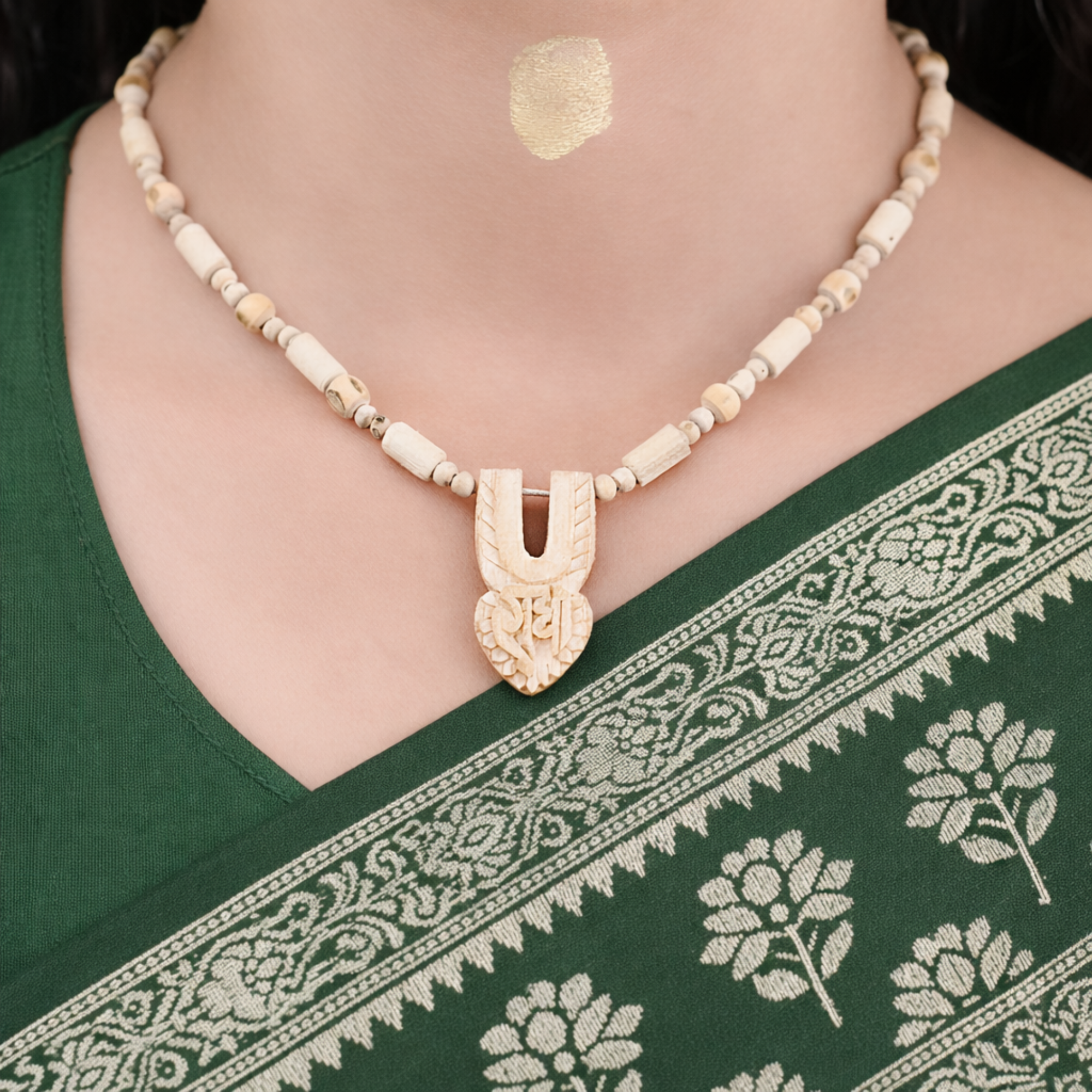 Woman wearing an authentic Vrindavan Tulsi Kanthi Mala with a carved Shri Radha tilak pendant