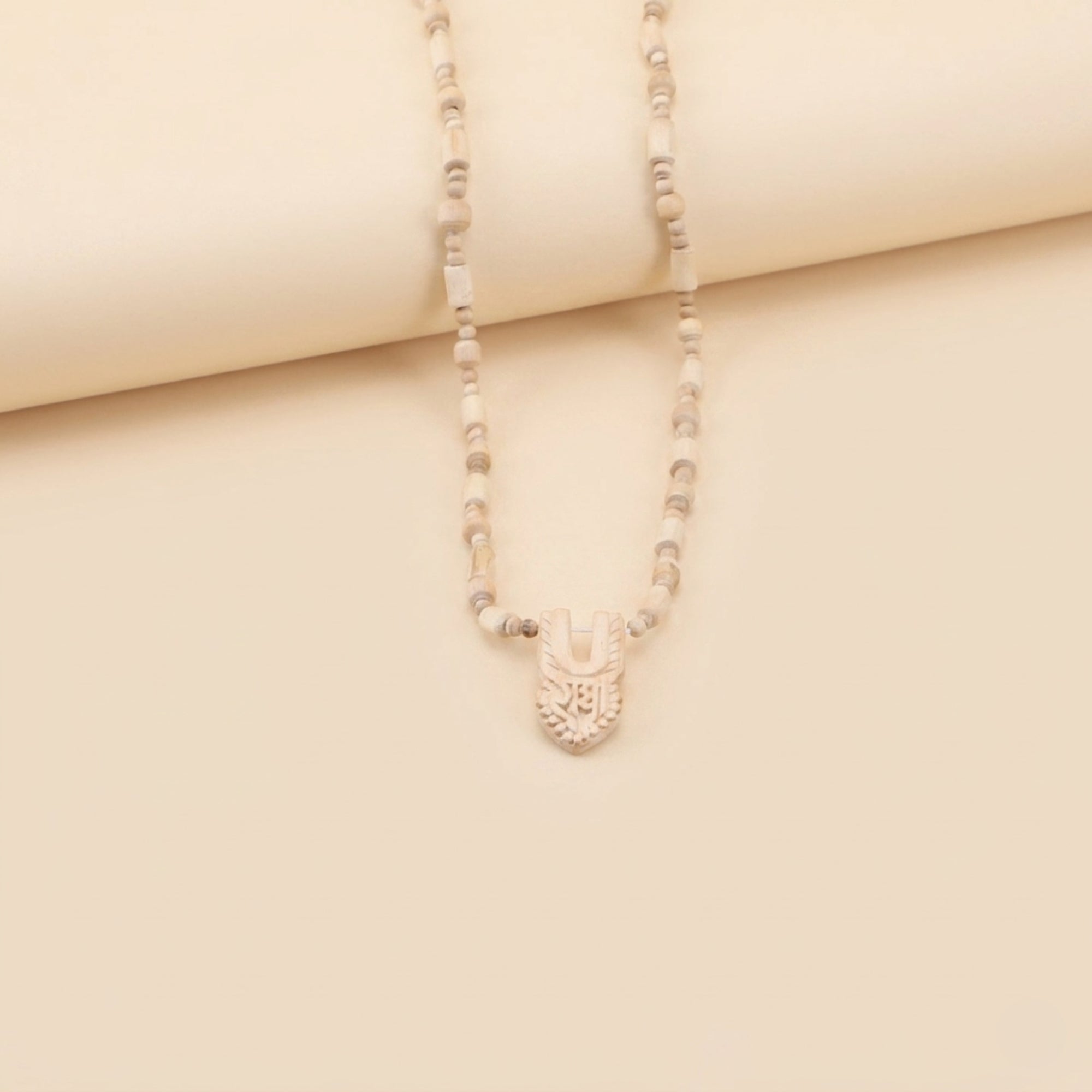 traditional Tulsi bead necklace with a carved wooden Shri Radha tilak pendant