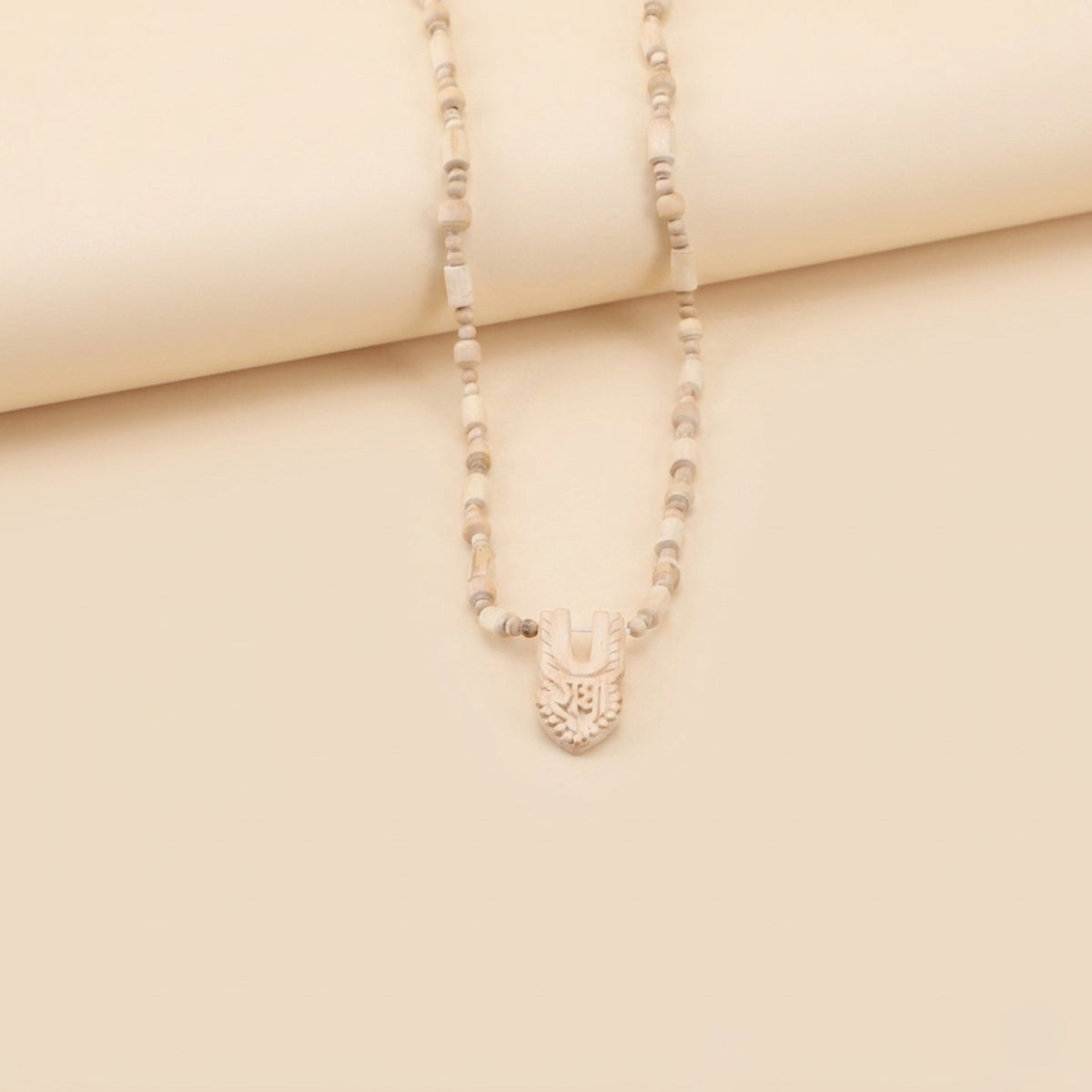 traditional Tulsi bead necklace with a carved wooden Shri Radha tilak pendant